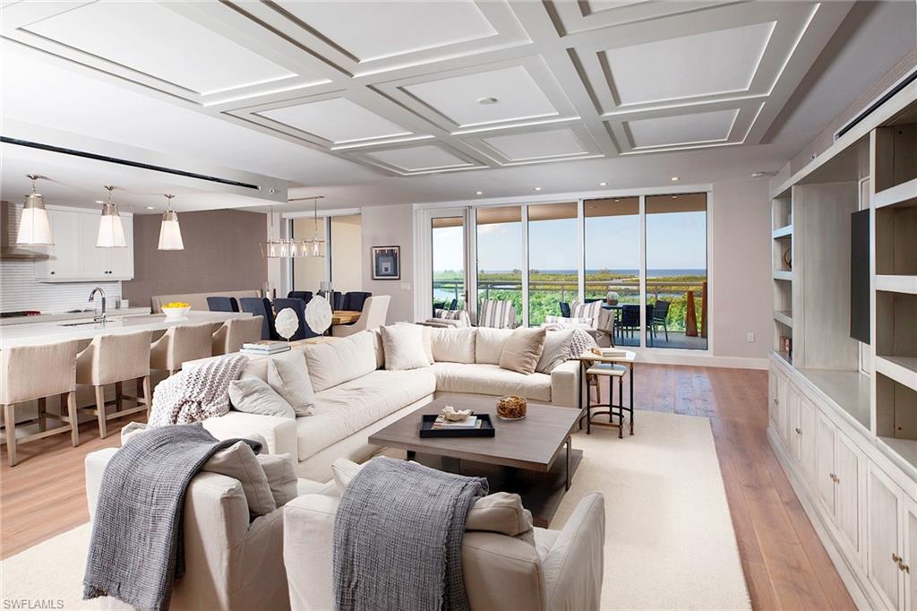 Phenomenal custom designed 4/4 RESALE unit in the award-winning KALEA BAY, TOWER 100. The spacious, open floor plan offers hardwood floors thru-out a sophisticated, yet casual interior design. Floor to ceiling windows span the entire living & dining areas, providing an abundance of natural light. The coastal interior blends perfectly with expansive views to the aqua Gulf waters. The gourmet kitchen offers a marble inlay backsplash, Wolf & Subzero appliances & natural gas cooktop. A Butler’s pantry includes Subzero wine cooler. An oversized Quartz waterfall island is the perfect spot to entertain. The serene decor offers a spa-like Master suite w/ 2 separate vanities, soaking tub & spacious shower. Two large en-suites boast custom finishes of applied moldings and shiplap walls. The over 500SF glass railed balcony is the perfect spot to enjoy the nightly sunsets. Tower 100 includes Naples’ 1st ever rooftop pool, open air fitness area & lounge, plus is pet friendly! Kalea Bay offers world class resort amenities, 24-hr manned gate, fitness, restaurant, bistro, 3 pools, outdoor bar, guest cottages & tennis/pickle ball center. Once here, you’ll never want to leave your 5-star vacation.