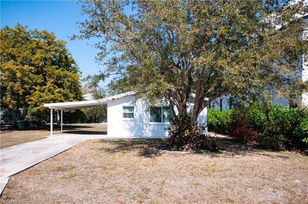 CUTE LITTLE BUNGALOW TOTALLY RENOVATED INSIDE AND OUT.  OPEN FLOOR PLAN NEW KITCHEN, BATHROOMS, FLOORS, WINDOWS, BLINDS ON ALL WINDOWS.  CARPORT HOLDS 1-2 CARS, LARGE YARD, ADDITIONAL BUILDING IN BACK FOR STORANGE AND WASHER DRYER SUPPLIED.