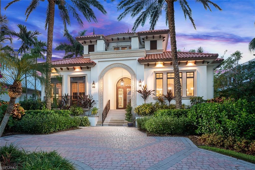 Unmatched location in the heart of Old Naples—just one block from 3rd Street South and three blocks to the beach. This timeless, elegantly updated home offers refined living steps from world-class dining, boutique shopping, and white sand shores.  The light-filled layout features a dramatic entry, soaring ceilings, spacious living areas, and a state-of-the-art chef’s kitchen. Natural materials, custom finishes, and bold accents create a sophisticated yet comfortable atmosphere. Enjoy seamless indoor-outdoor living with a serene courtyard, pool, lanai, and private guest cabana. A rare opportunity for those seeking a low-maintenance ease, and a lock-and-leave lifestyle in one of Naples’ most desirable neighborhoods.