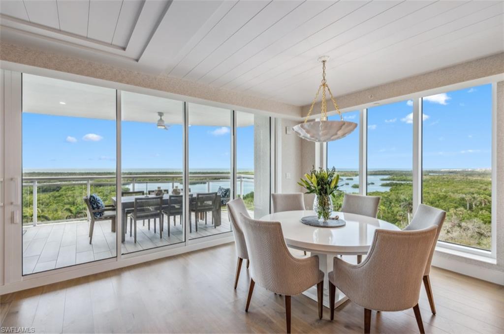 Perched on the tenth floor of the coveted Kalea Bay Tower 200 this stunning end-unit residence redefines luxury living on the Southwest Florida Gulf Coast. Offered with three bedrooms, a den, and three and a half baths, every inch of this designer masterpiece has been thoughtfully curated — from the custom built-ins and bespoke furniture to the breathtaking ceiling treatments that draw the eye skyward. Walls of glass flood the open living spaces with natural light, highlighting hardwood floors and a coastal, sophisticated palette. The chef's kitchen is appointed with Wolf and Sub-Zero appliances, a coveted butler's pantry, and the rare advantage of natural gas — a true entertainer's dream.

The owner's retreat is nothing short of extraordinary. A sweeping wall of windows frames the kind of view that makes waking up feel like a luxury in itself, while the spa-inspired bath invites you to linger — generous in scale, impeccably appointed, and finished with the same bespoke attention to detail found throughout the residence. Two private guest ensuites ensure that family and visitors never want to leave all within Kalea Bay’s five star amenities