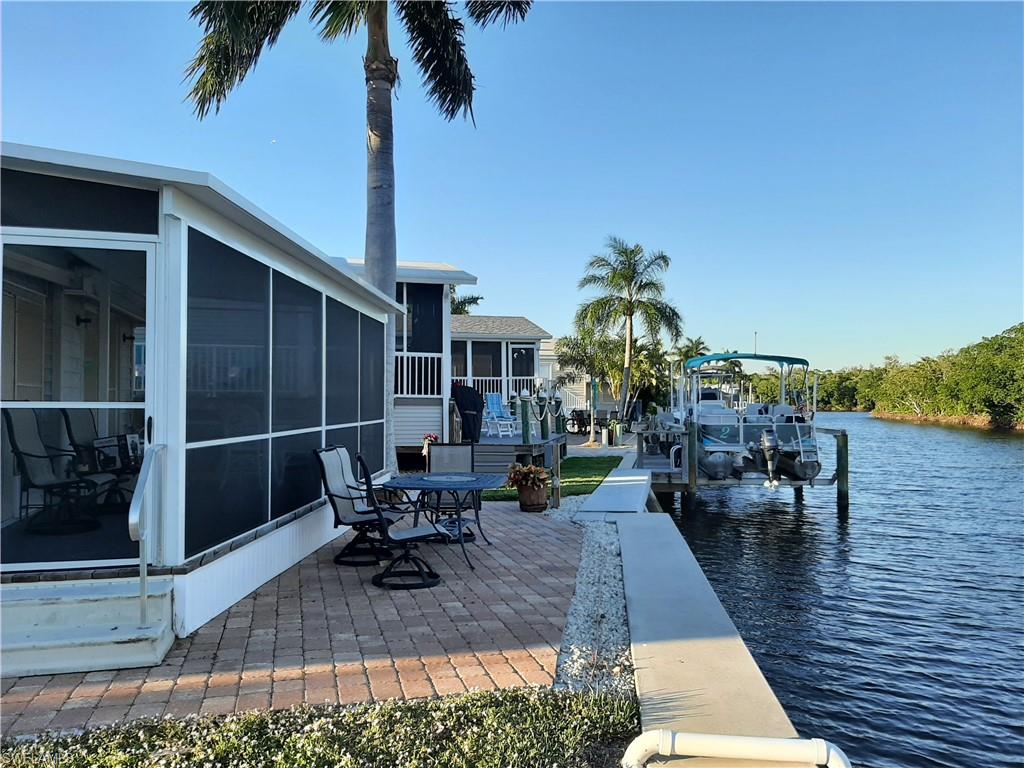 PERFECTLY LOCATED, CANAL FRONT BAY AND GULF ACCESS MANUFACTURED HOME IN THE 55+ AGE GROUP COMMUNITY OF PORT CARLOS COVE IS WAITING FOR YOU.  THIS TWO BEDROOM, TWO BATH PROPERTY IS TURNKEY FURNISHED AND IS EXTREMELY WELL MAINTAINED. YOUR VIEW IS A WIDE CANAL AND A WOODED PRESERVE. PORT CARLOS COVE IS THE FINEST WATERFRONT MANUFACTURED HOME COMMUNITY IN THE FORT MYERS BEACH AREA. WALK, BIKE OR RIDE TO THE POOL, RESTAURANTS AND THE WHITE SAND BEACH ON ESTERO ISLAND.