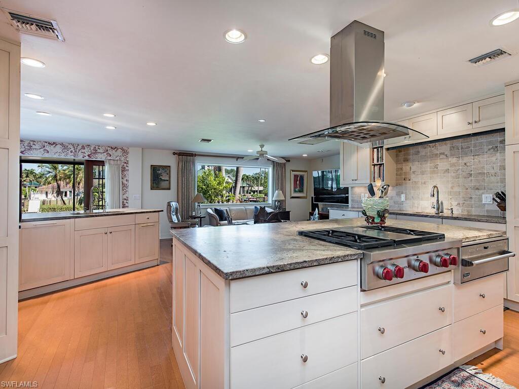 Situated on a highly desirable lot backing up to Bowline Bay, this exceptional property has Gulf access and NO bridges! This is the perfect location for a sailboat or larger vessel. West of Crayton Road, this home is a mere five minute walk to the private Moorings Beach Club where owners can join for a nominal fee.