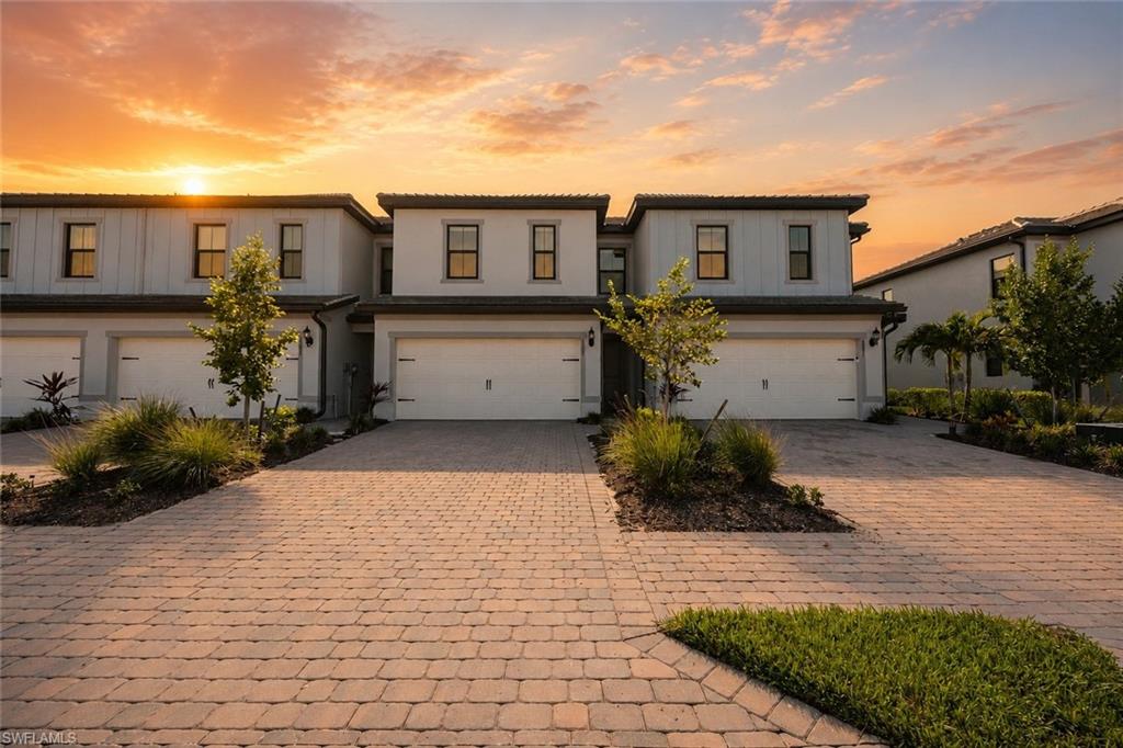 Move-in ready in Sonoma Oaks! This upgraded Augusta floorplan offers 3 bedrooms, 2.5 baths, and a 2-car garage with over 1,900 square feet of thoughtfully designed living space. Eastern exposure floods the home with soft morning light, and the screened lanai is made for slow coffee mornings before the day gets going. The kitchen is a true centerpiece, featuring quartz countertops, upgraded GE Profile smart appliances including a double oven, and hand-blown glass pendant lighting above both the island and dining table. Adaptable Container Store storage systems outfit the primary and guest bedroom closets, while power roller shades on the first floor and top-down/bottom-up cellular shades upstairs offer effortless light control throughout. Impact-resistant windows and doors add peace of mind, and transferrable Pulte warranties carry forward for the next owner. Additional smart-home upgrades include a GE front-load washer/dryer, in-duct whole-house air treatment system, smart garage door, epoxy garage flooring, pre-wired for an electric vehicle charger, and a Nest thermostat and doorbell. Fiber-optic internet and no CDD keep monthly costs simple. Ideally located between Collier Blvd and Vanderbilt Beach Rd, Sonoma Oaks residents enjoy a heated community pool, cabana, and grilling area, plus easy access to Naples' renowned dining, shopping, golf, and beaches all within a rapidly growing area of Southwest Florida.