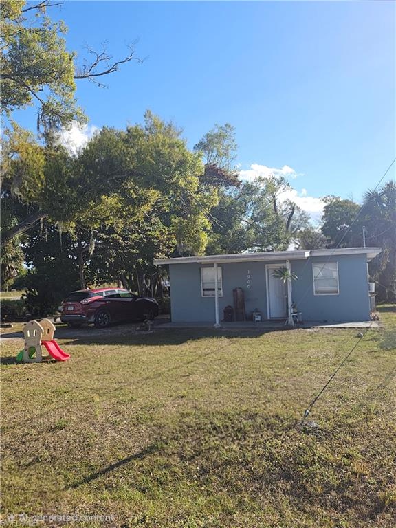 3BR/1BA Single-Family Home on Oversized Lot With Dual Street Access. Adjacent Lot Also Available for Purchase see MLS 2026004944. Discover a well-located 3-bedroom, 1-bath home at 3966 Madison St, Fort Myers, FL 33916, offering excellent access to both US-41 and I-75. This property features a functional layout, tile throughout, an additional utility room, and sits on an oversized lot with dual access from Madison St and Bells St—a valuable setup for owners needing space for large trucks, trailers, equipment, or work vehicles. The expansive lot provides flexibility for storage, parking, or future improvements.  Showings by appointment only. A strong opportunity for buyers seeking space, accessibility, and long-term potential in a central Fort Myers location.