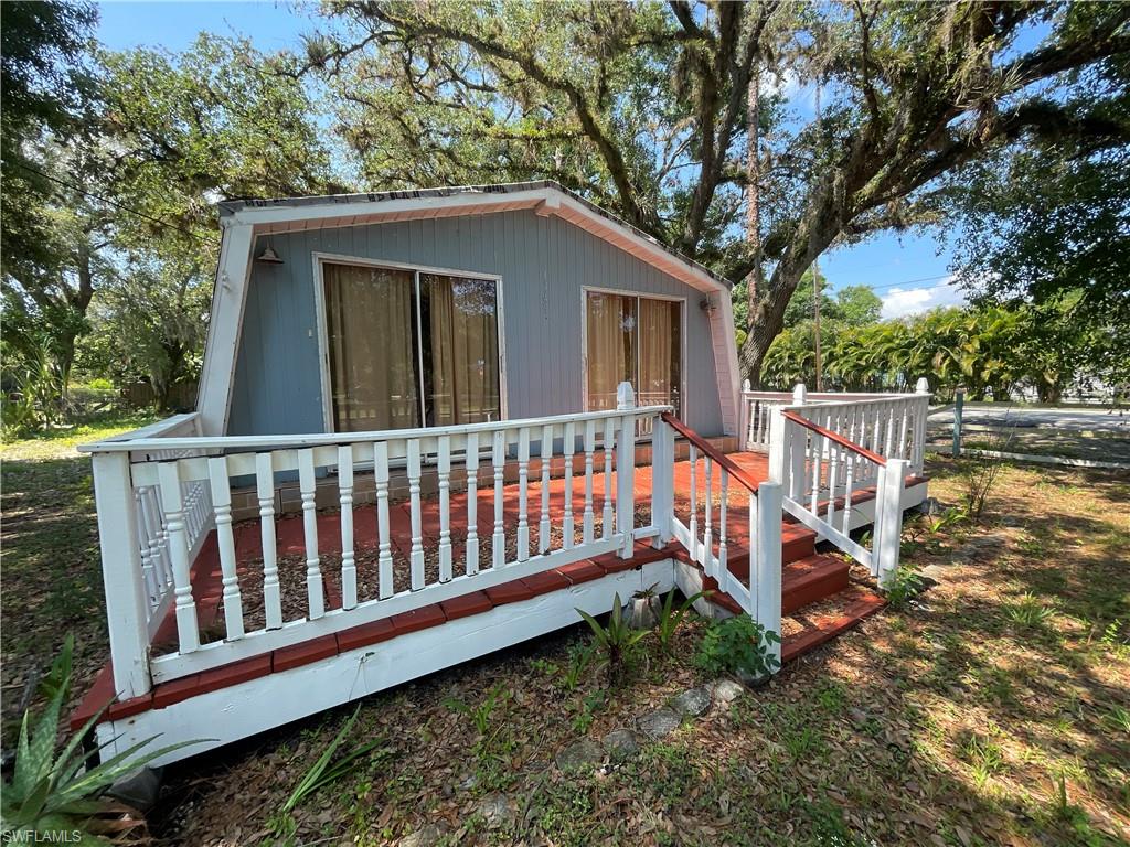 Investor opportunity! This A-frame-style home sits on a lot shaded by mature oak trees and offers strong potential for renovation, rental income, or resale. Featuring 1 bedroom and 1 full bathroom, the property includes a large front deck, rear carport, and yard space. Located just minutes from downtown LaBelle with easy access to shopping, dining, and local amenities. A major bonus for short-term or long-term rental appeal is the nearby Hendry County boat dock, providing direct access to the Caloosahatchee River, ideal for boating, fishing, and outdoor recreation. With vision and updates, this property presents an excellent value-add investment opportunity. Call today and schedule your appointment!