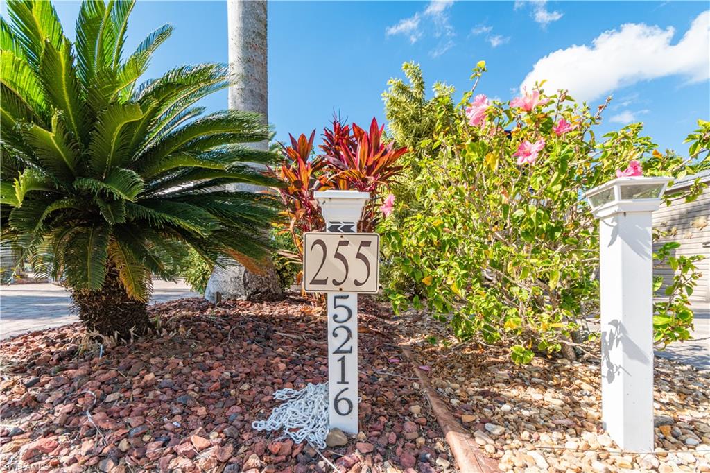 Welcome to Lot 255, a beautifully improved 35’ x 90’ lakefront pavestone lot located in the highly sought-after Cypress Trail RV Resort and walking distance to amenities. This exceptional property offers stunning water and fountain views, mature tropical landscaping for added privacy, and multiple upgraded outdoor living features. Enjoy the best of Florida living under the spacious tiki hut, perfect for relaxing or entertaining while taking in tranquil lakefront scenery. The property includes a built-in outdoor kitchen with grill, prep space, and storage, making outdoor dining effortless. A large open patio provides plenty of room for seating, sunbathing, or gathering with friends. The finished 8’ x 15’ shed is equipped with tile flooring, a mini-split A/C, a sofa sleeper, shelving, and a refrigerator—ideal for guests, hobbies, or extra storage. The shed also includes a bathroom with a toilet and sink for added convenience. Additional upgrades include expansive paver work, lush landscaping, outdoor seating areas by the water, and close proximity to all resort amenities. Cypress Trail RV Resort is a gated community offering top-tier amenities including a clubhouse, pool and spa, pickleball and tennis courts, dog parks, fitness center, community events, and more. This lot offers the perfect blend of comfort, privacy, and resort-style living—your ideal Florida retreat.