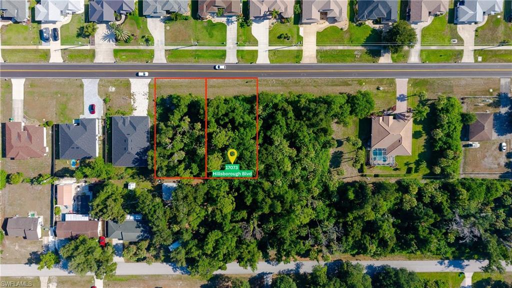 PRIME PORT CHARLOTTE LOCATION  SINGLE OR DOUBLE LOT INVESTMENT OPTION! Build your Florida dream home on this premium 0.23 acre residential lot (10,000+ sq. ft.) situated on paved Hillsborough Boulevard. Located in a rapidly growing, established neighborhood surrounded by beautiful contemporary homes, this lot features electricity, cable, and phone lines readily available at the street. With NO HOA fees or building timeframes, you have total freedom to bring your own builder and construct whenever you are ready!

PACKAGE DEAL: The adjacent lot (17065 Hillsborough Blvd) is also available! Purchase both parcels together to secure a massive 0.46-acre double lot boasting 160 feet of prime road frontage. The seller is motivated and ready to structure a  package deal for a combined purchase. Enjoy an exceptional location with seamless access to world-class golfing, pristine beaches, shopping, dining, and I-75. Don’t miss out on doubling your footprint—bring your offer today!