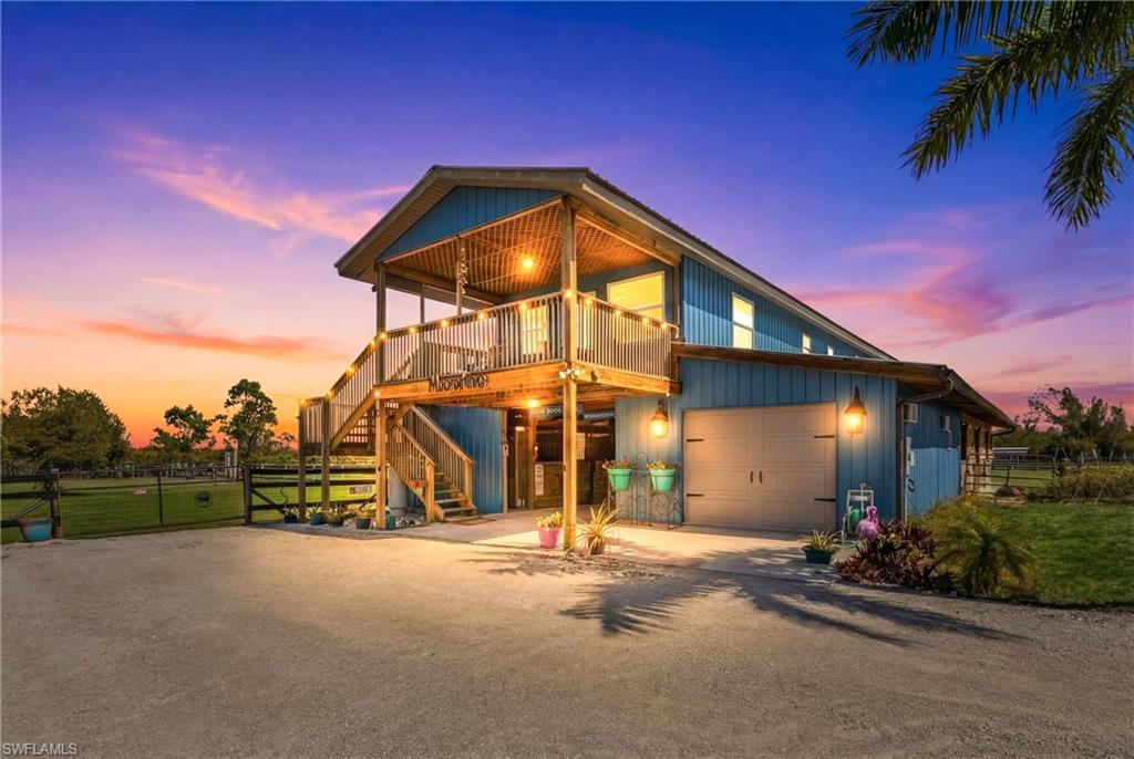 LOOKING for a Florida HORSE facility? BUILD your Florida dream home here and have your horses on the property! We have award winning builders that can quote a price for new home package using their plans or YOURS. Almost 7000 sq ft total under AC! Barn and House living, storage and tack room*
Moonshine Acres Tropical Horse Farm, is an equestrian BARNOMINIUM property that has sanctuary for both horses and their riders alike on Pine Island FL. Located on a private double gated entry off Stringfellow Road, this 8.85 acres of land is YOUR opportunity to own and grow your business which could include boarding, lessons, training or expand to trail rides and breeding too. A completely HORSE fenced property that backs to 12 miles +/- of trails that lead directly to Gulf waters to swim HORSES. Eight expansive and adjoining paddocks, 8 of which are interconnected for uninterrupted movement, plus a dedicated paddock designed for specialized care (a total of 9). 
Providing a safe and comfortable environment for your horses to enjoy. Riders wanting to ride and enjoy their horses or peaceful leisurely rides, the property is equipped with a Regulation Small-Size Dressage Arena that ensures the ideal setting for training or casual riding. At the heart of the farm is a professionally designed barn, laid out to meet equestrian standards. The barn houses 8 spacious stalls, each outfitted with automatic watering systems and cooling fans to ensure comfort for horses. Tack Room offers ample storage for all your riding gear, a private bathroom and a Feed Room. The barn also includes a comfortable updated 2-bedroom, 1-bathroom Living Quarters, kitchen and 2 balconies with tremendous farm views! This BARNDOMINIUM is a perfect home for on-site care or staff. The HORSE property is equipped with additional structures, including a hay shed, a 30’ x 50’ workshop, and a carport large enough to accommodate RVs or horse trailers. There is a run-in shed and convenient wash stalls. You will see the property offers the potential to build your custom Florida dream home, tailored to your specific equestrian lifestyle and preferences. Moonshine Acres is more than just a farm; it is an established, successful business address. The idyllic setting of Pine Island also provides easy access to the Gulf of Mexico, offering water sports, fishing, and beach outings. This is a beautiful equestrian paradise for horses and riders, coupled with the laidback lifestyle of Southwest Florida’s Gulf Coast. 
This also has many other potential uses including rezoned commercial use, Public storage facility, Auto, RV and Boat storage, a must-see consideration for investment.