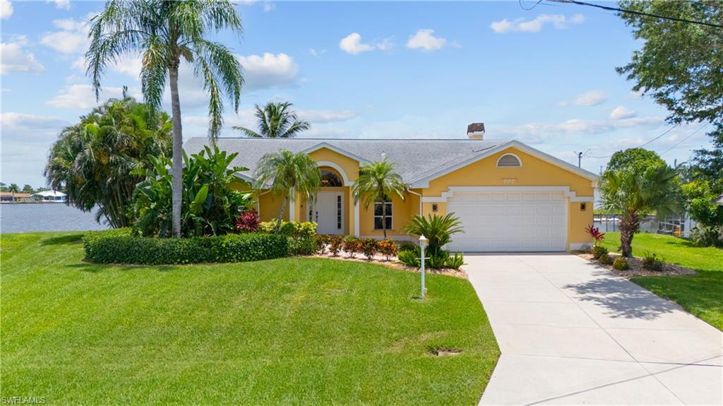 LAKEFRONT LIVING • TURNKEY AIRBNB • NO FLOOD INSURANCE REQUIRED • NEVER FLOODED • NO HOA • PERFECT SUNRISE VIEW EVERY MORNING!

Welcome to your private lakefront retreat in the heart of Cape Coral! Situated on a beautiful freshwater lake, this meticulously maintained 3-bedroom + den, 3-bathroom pool home offers over 2,100 square feet of comfortable living space with breathtaking water views from every bedroom.

Designed for both relaxation and entertaining, the spacious open-concept floor plan features a formal dining room, a cozy wood-burning fireplace, and an abundance of natural light throughout. The well-appointed kitchen flows seamlessly into the main living areas, creating the perfect space for gathering with family and friends.

Step outside to your screened lanai and sparkling pool overlooking the lake, complete with a convenient pool bath for guests. Enjoy peaceful mornings watching the sunrise over the water and unwind in the evenings with panoramic lake views from nearly every room in the home.

The spacious primary suite offers direct water views along with a luxurious bathroom featuring both a soaking tub and separate shower. A versatile den provides the ideal space for a home office, media room, or additional guest accommodations.

This home has been thoughtfully updated and offers peace of mind with numerous recent improvements, including a new roof (2020), new HVAC system (2023), new pool pump (2023), new water heater (2024), new electrical panel and whole-home surge protector (2025), and a new pool compressor (2025).

Currently operating as a successful turnkey Airbnb, this property presents an exceptional opportunity for investors, seasonal residents, or anyone seeking a move-in-ready waterfront lifestyle. Located in a no flood zone with no flood insurance required, no HOA restrictions, and a history of never flooding, this home offers peace of mind alongside its incredible income potential.

Whether you’re looking for a full-time residence, vacation home, or income-producing investment, this lakefront gem checks all the boxes. Schedule your private showing today and experience waterfront living at its finest.
