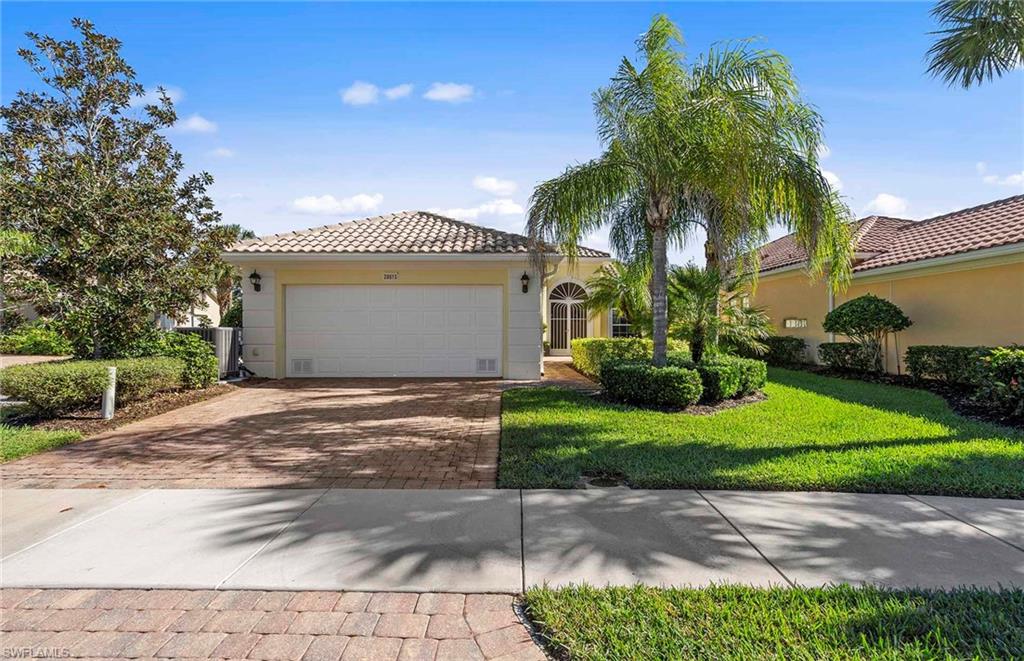 You will fall in love with this very private beautifully updated home in Village Walk. Undeniably one of the nicest listed Oakmont's on the market. Sparkling kitchen is completely redone including brand new appliances, white cabinets with overheads removed, custom pullout drawers, new back-splash and all new lighting. Wonderful private lot overlooking the heated pool with large grassed backyard that leads to the beautiful lake. This is an end lot so only one neighbor! Hurricane Shutters installed, new AC and new Hot Water Heater. This DiVosta built poured concrete home with three bedrooms plus den is very spacious, sunny and has wonderful high ceilings and large living room with no wall unit. There is great storage in the home including a large laundry room and 2 car garage with overhead storage. Village Walk has everything you could want for amenities- 8 HarTru tennis courts, bocce, pickle ball, 5 miles of walking within the community on sidewalks, gas station, car wash, hair salon, a restaurant, coffee shop, community center with a full time Activities Director. Gated with guard 24/7, LOW HOA fees and pet friendly. What's not to love!