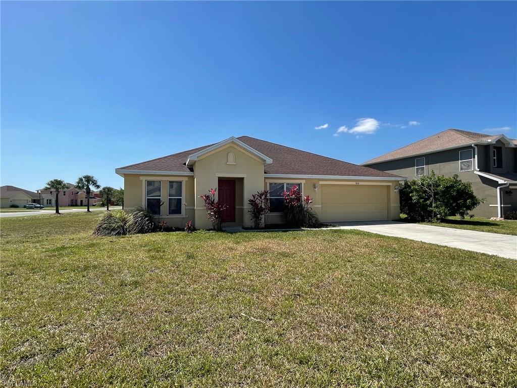 Town Lakes in Lehigh Acres is a gated community just off Williams Avenue. It has security, central sewer and water and has a consistent look to the community since most of it was built by just one builder. There have been a few newer homes with another builder, but the design is similar. The homes are concrete block with stucco and are a modern Florida style. This home is a 3 bedroom plus Den, 2 full bathrooms, built in 2006 and is located on a lake within the community. It has an open floor plan with a formal dining/living room combination and a separate family room with an island kitchen. The Master suite is separate from the other bedrooms and is at the rear of the home with a lake view. It has a 2 car garage and storage within plus a sidewalk for safety. Come see one of the few gated communities in Lehigh Acres and start your comfortable lifestyle in Town Lakes.