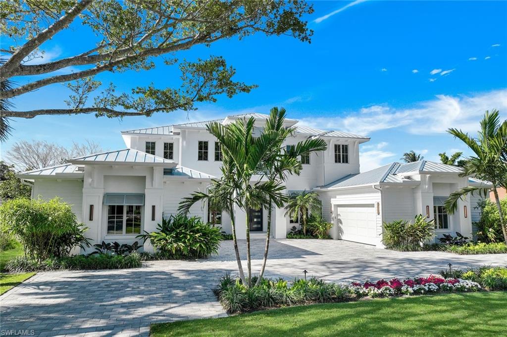 Timeless elegant design, highest quality construction and light filled southern exposure converge beautifully in this stunning new construction Moorings home that is ready to enjoy this season. Built by Dillman Construction, one of Naples premier luxury builders, the expansive 2-story plan provides the utmost in living and entertaining options, with both downstairs and upstairs living areas and gorgeous outdoor patios and terraces on both levels. The tranquil primary suite is a haven of relaxation, with a spa-inspired marble bathroom, while a secondary bedroom suite on the ground floor and two additional suites upstairs provide ample accommodations for family and guests. The home’s interior is a testament to luxury, adorned with Legno Bastone oak flooring, extensive custom woodwork & wainscoting adding to the elegance. Other features include Sub Zero & Wolf appliances, a hidden walk-in pantry, elevator, whole house generator, two linear fireplaces, Lutron lighting system and 2, two-car garages. Outside, the gorgeous south facing outdoor area incudes a 41-ft lap pool with waterfall and spa, plus multiple fire features. There’s also an expansive outdoor living area & kitchen with linear fireplace, outdoor shower and electric screens and shutters. All of this is complimented by the beautifully landscaped and private grounds which provide serene views from every room. Private beach access with parking is available through the Moorings Property Owner’s Association for a nominal fee.