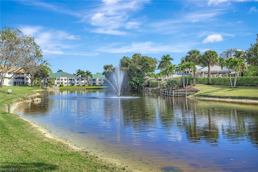 One or more photo(s) has been virtually staged, AI generated or rendered.  Welcome to Princeton Place at Wiggins Bay in one of the most desirable areas in North Naples, ideally positioned west of US-41 with convenient access to Gulf beaches, world-class dining, shopping, and coastal recreation. This 2-bedroom, 2-bath property spans 1,356 sq. ft. of light-filled living space. A split-bedroom layout ensures privacy for guests, while the spacious open great room with dining and living combination flows naturally to a screened lanai, where peaceful lake and landscaped views set the tone for relaxed Florida living. The kitchen features a stylish breakfast bar perfect for casual mornings, plus plenty of cabinet and pantry space. Walk-in closets, in-unit laundry, and a large great room for living and dining round out the thoughtful interior. What truly sets this community apart is the lifestyle it offers. Wiggins Bay residents have the opportunity to inquire about private membership at the Tarpon Cove Yacht & Racquet Club, unlocking access to a private beach shuttle to the Gulf, Har-Tru tennis, fitness facilities, bocce ball, a pool and tiki bar, and vibrant social dining. The community is also home to the Wiggins Bay Dock Owners Association, where boat slip rentals or purchases may be available - a rare find in North Naples.
