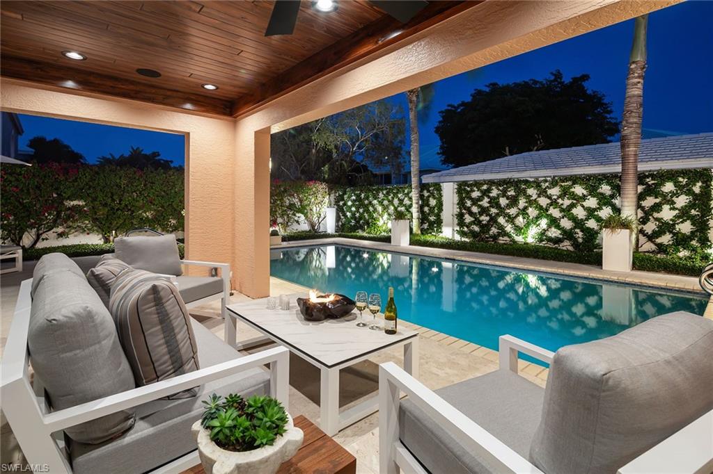 Absolutely enchanting single-family home in the heart of Pelican Bay describes this fully renovated gem. Fabulously reimagined, this home boasts gorgeous wide plank white oak flooring throughout most of the home, 3.5 chic and well-appointed baths, chef’s kitchen featuring white-shaker cabinetry, Wolf gas oven, stainless appliances, pullouts and more, superb, sophisticated design and architectural elements throughout, and a one-of-a-kind signature gathering room with soaring ceilings. The magical outdoor space on this oversized lot boasts charming covered living space, resort-like vertical pool, huge immaculate yard and captivating landscaping with gorgeous bougainvillea, crisscross ivy and superb outdoor lighting. The added bells and whistles include impact windows and doors, new roof, epoxy floor in garage, whole-house generator, buried propane, Zone X location outside the floodplain, and more make this home move-in ready. Pelican Bay offers two private beach clubs with dining and state-of-the-art community, tennis and fitness center, as well as nearby world-class shopping and dining at Waterside Shops, the Mercato and Artis-Naples.