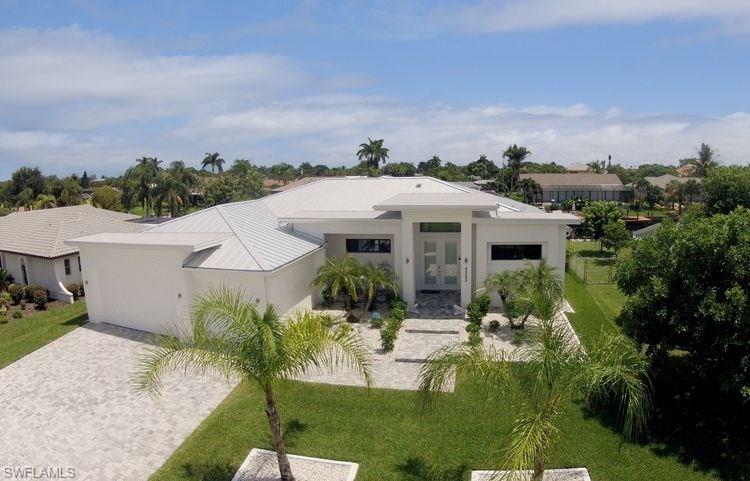 HUGE PRICE REDUCTION !! SELLER WANTS OFFER. ELEGANT DIRECT SAILBOAT GULF ACCESS POOL HOME IN THE DESIRABLE YACHT CLUB NEIGHBORHOOD. This custom home built in 2012 with a contemporary design style features 3 Bedrooms, 2.5 Baths, a 3-car garage, low E - impact resistant windows and doors and a metal roof. Being sold as an Investment Vacation Rental or Buyers move in. The double door Entry leads you right into the spacious Foyer. The beautiful gourmet kitchen design includes designer cabinetry, granite counter tops, stainless steel appliances, wine cooler, wall oven combo, and a breakfast bar. Master suite has a sitting area,  sliding doors to the lanai, his and hers walk-in-closets, dual sinks, walk-in shower with double shower heads, and a soaking tub. The custom build electric heated pool / spa with picture screens and outdoor kitchen makes this the perfect place to entertain. BOATERS DREAM come true with TWO Boat lifts each 10000 pound, captains walk, and a composite decking. Only 5 minutes to the Gulf of Mexico. All Assessments paid. There are too many features to list for this stunning home. Make your showing appointment today! SELLER WANTS OFFER !!!!