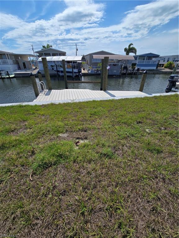 Experience the dream of living on a sub-tropical island with views of palm trees with your boat ready to go offshore. This property has a newly installed seawall and dock, has direct Gulf access with no bridges to accomodate a sailboat. Filldirt has been added with sod in the back to raise the elevation. This offers access to world class fishing and to beautiful beaches, Sanibel, Cayo Costa, Fort Myers Beach or Boca Grande just to name a few.  Pine Island itself has so much to enjoy, such as local bars/restaurants with live music, Lee County Parks, churches, a library, public pool, shopping and hosts many fun events. Don't hesitate on making an offer because this is a really nice lot.
It previously had a manufactured home on it, so no impact fees will be required when you decide which style you want to put on it.