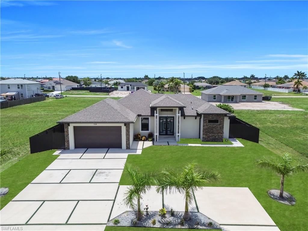 Welcome to your dream home in Cape Coral, Florida! This stunning single-family home boasts 3 bedrooms, 3 bathrooms, and a 2-car garage, perfect for families or those who love to entertain. The modern kitchen features quartz counters, stainless steel appliances, and tile flooring, making it a chef's paradise. With city water and high ceilings throughout, this home offers both convenience and luxury. The impact doors provide security and peace of mind, while the centrally located property allows for easy access to all that Cape Coral has to offer. Built in 2023, this home is equipped with all the latest amenities and modern touches. Imagine relaxing in your own private oasis with a space for a pool, perfect for enjoying the Florida sunshine. Don't miss out on the opportunity to make this beautiful home yours and start living the ultimate Florida lifestyle today!