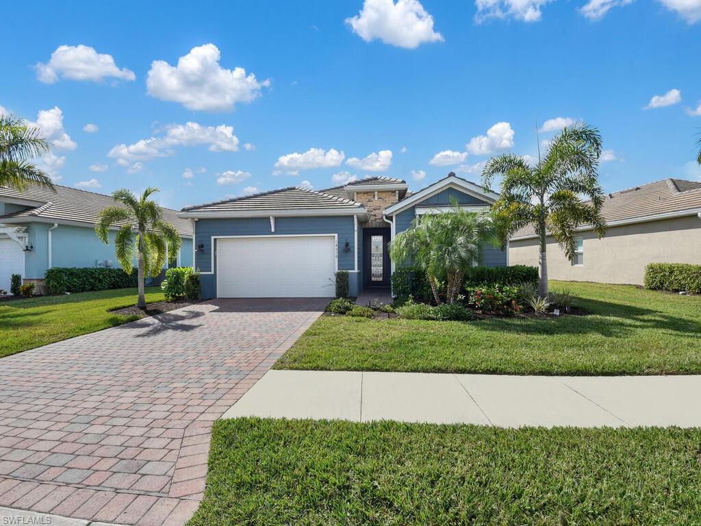 JUST LIKE NEW - BUILT IN 2019! This Delray Floor Plan offers luxury features throughout - upgraded tile flooring in main living areas, stunning light fixtures & hardware, all impact resistant windows, remote control shades w/ black out feature, remote control fans, and a high-end security system w/ cameras/audio/recording. Naples Reserve is a gorgeous gated community designed for those seeking resort style amenities along w/ a casual SWFL lifestyle. Centered around a beautiful 125-acre private lake having a guard at gate 24/7, Island Club with tiki bar, café, tennis, basketball, benches for relaxing around the lakes, resort-style pools, and nature preserves.