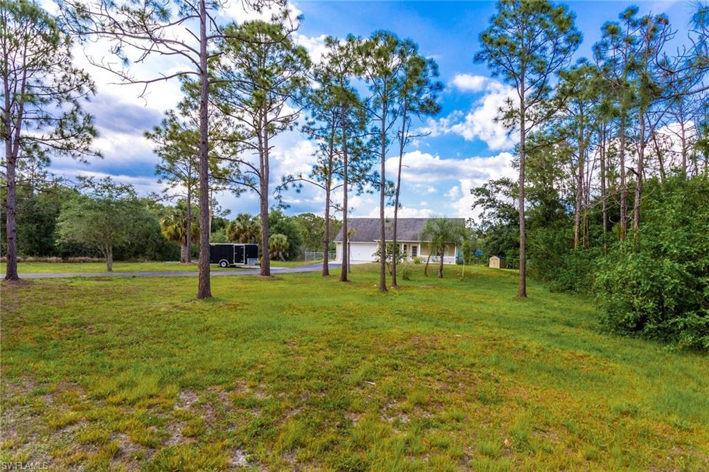 A MUST SEE HOME*** Fantastic Location!! This wonderful home offers 2.73 acres of well-kept and clear grounds, plenty of room for a pool, truck or horses.. completely  fenced with a  paved drive way. This property has been painted inside,  well maintain, move in ready condition for a new family to enjoy all it has to offer. Single family home with nearly  1,500 sq. ft. of living space, located in one of the best areas of Golden Gate Estates. Best schools, situated  in the midst of Everglades Blvd  Rd. off of Oil Well Rd .  Tiled,  laminated flooring  throughout the main areas, carpet in bedrooms. This stunning home features 3 bedrooms,  MBR has  walk-in closet and master bathroom with two sinks . Second full bathroom with  vanity and tub, updated  kitchen with newer countertops, back splash & stainless steel appliances,  newer Air Conditioning System, laundry room and much more... This home will not last. Call today!