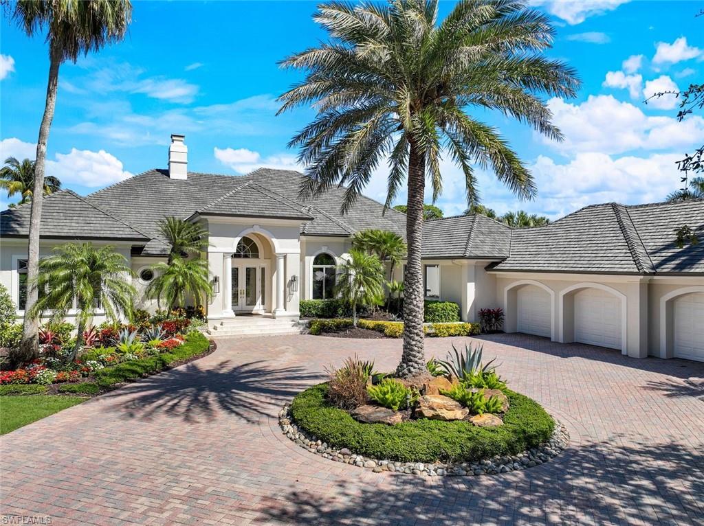 This stately home, located in the esteemed Spring Ridge of Bonita Bay, is simply gorgeous! While several areas of the home have been updated, the original character and craftsmanship of this home have been left untouched. Seamlessly blending the original with the new, you will surely fall in love! Comfortable and gracious, you will want to call this house your HOME! This home offers many intimate spaces beginning with the entryway and "formal" living area. The family room, formal living room and primary bedroom all open onto the sizable lanai and pool area. The spacious lanai is where you will spend the majority of your winter days, as it offers a bar, outdoor kitchen, pool, spa, plenty of covered seating area and tons of privacy.  Boasting 3 bedrooms plus a den/office, a formal living/dining area, family room open to the kitchen and 3 and a half bathrooms, there is plenty of space for all to enjoy!  The kitchen features an abundance of custom cabinetry, a center island and SO MUCH storage space! Spacious primary bedroom, two guest bedrooms privately tucked away from the primary, beautiful marble flooring throughout the main living areas, volume ceilings, sliding doors leading out from the living, kitchen and primary bedroom, a working fireplace & SO much more. There is a wet bar located between the formal dining room and family room. There are so many unique and desirable details of this home that need to be seen in person in order to be fully appreciated. Perfect location, perfect community and the PERFECT home in Spring Ridge! Beautifully landscaped, stately and majestic. THREE car garage, new roof and newer AC units! This lovely, well priced home, awaits the personal touch of its new owners. Bonita Bay is centrally located, just minutes to the airport, fine dining, 5th Avenue, Mercato, world renowned beaches and the burgeoning downtown Bonita Springs!