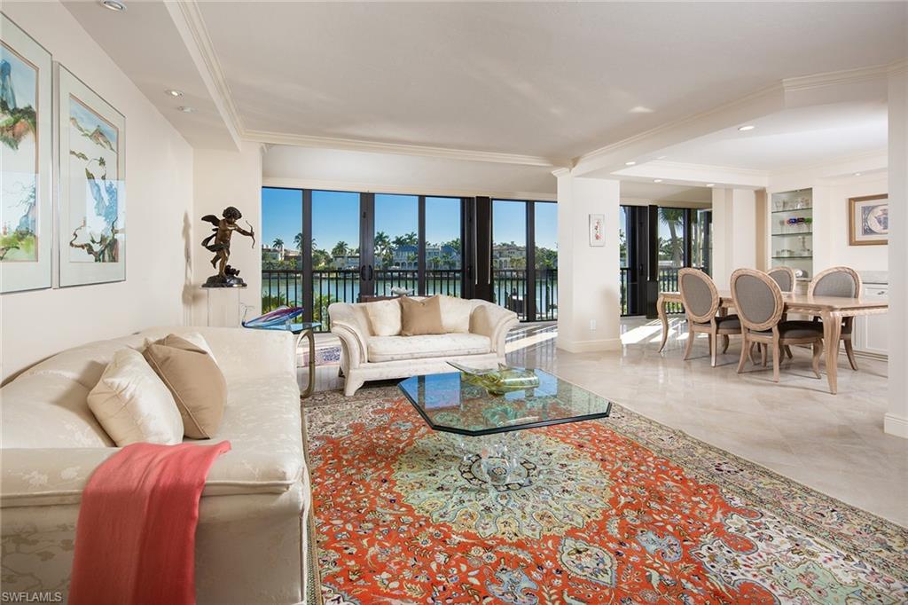 Wide bay views of Moorings Bay are the focal point of this chicly designed 2 bedrooms plus den residence. A newly renovated, open kitchen with Quartzite countertops and full backsplash surrounded by shaker, custom cabinets, provides a coastal refinement. The updated bathrooms have been furnished with modern elements to include new glass shower doors, white marble shower walls and elegant fixtures, which are sure to impress. Residents will also appreciate the ability to have hard surface flooring throughout in the unique first-floor apartment. Situated in the resort like community of Admiralty Point which offers extensive amenities that residents can take advantage of including, community boat docks, two clubhouses each with separate pool and spa, two Har-Tru tennis courts, kayak launch and fish cleaning station, this is a rare opportunity to enjoy both beach and Bayfront living.