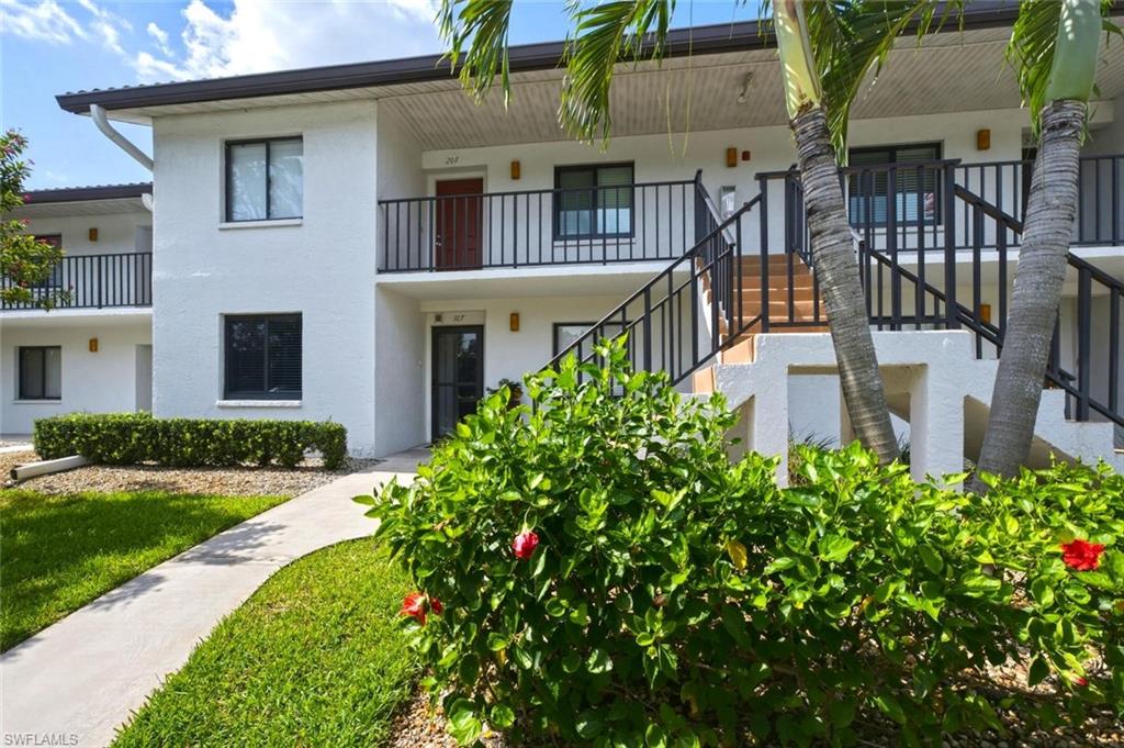 Turnkey furnished condo!! Move in ready!!  Convenient first-floor condo with a deeded, detached carport which is a few steps from the screened entry door adding to easy everyday living. Condo updates include the LG stainless-steel refrigerator, full size Whirlpool washer and dryer, king Sleep Number adjustable-firmness mattress set, new motor for the electric shutters, impact windows, and a soft green electric leather sofa for relaxed viewing of your favorite shows.  A two-ton Ruud A/C system with a Nest thermostat which offers remote access to ensure year-round comfort. The kitchen offers solid surface countertops and extra cabinetry for storage. Tile flooring extends throughout the condo with no carpeting to maintain. The screened lanai offers easy access to the gorgeous landscaped heated pool and spa for relaxed outdoor living.  The Regency Woods board carefully manages the budget and the reserves, resulting in reasonable association fees. The roofs were replaced with a durable metal roof that closely resembles tile. A short drive takes you to the world-class destination of Old Naples, where residents enjoy easy access to beaches, shopping, and fine dining. This condo offers a wonderful opportunity for a first-time homeowner or for use as a getaway retreat