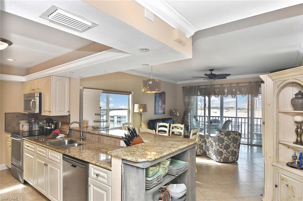Here's a special opportunity at Hibiscus Pointe! Open and bright, updated 3 Bed 2 Bath top floor corner unit with panoramic Gulf and Island views plus a deeded dock and boat lift! This exceptional property is Turnkey furnished featuring an open kitchen with granite countertops, stainless steel appliances, tray ceilings, Crown molding throughout, tile plank flooring in the bedrooms, tumbled stone diagonal tile flooring in the living room, kitchen and foyer, southern exposure side windows with retractable sun shades, Plantation shutters in all bedrooms, a bidet (in addition to the standard fixture) in the master bath, electric storm shutters on the southwestern exposure lanai, new boat lift control box, deeded under building parking space, too much to list! This property has to be seen to be appreciated! Hibiscus Pointe is walking distance to the deeded beach access and Santini Plaza which offers restaurants, bars, shopping, CVS, Medical clinic, full service marina, and much more. There's also a Farmers Market 2 days a week during the winter season. This property has it all and offers the best features Fort Myers Beach has to offer! Easy to show and ready to go!