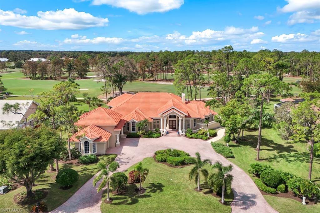PRICE REDUCED $300K + NO GOLF WAITLIST!  Set on one of the most captivating home sites in Quail Creek, this newly renovated estate pairs extraordinary architectural character with luxurious modern details. Spanning approximately 4900 square feet under air, the home impresses upon entry with soaring 15 foot ceilings, intricate crown molding, and walls of glass that frame panoramic views of the golf course across over 70 acres of lush fairways and greenery. The reimagined lanai is among the largest in the community and has been completely transformed with a redone pool and spa, nearly 2000 square feet of covered living space, and a custom, stone tiled, outdoor kitchen with a new grill and beverage cooler. After enjoying the ultimate outdoor lifestyle you’ll find a showstopping kitchen inside, renovated with striking quartz countertops, a waterfall edge island, custom wood cabinetry, and premium stainless steel appliances including a Sub-Zero refrigerator and freezer. Just off the kitchen, a stunning wine wall and bar, designed to showcase over 160 bottles, serves as both a focal point and an entertainer’s dream. The spacious living room is anchored by a dramatic stacked stone fireplace and flows effortlessly into multiple indoor and outdoor gathering spaces. The grand owner’s suite is a true luxury retreat with dual walk in closets, a one of a kind vanity dressing area, private seating space, and direct access to the lanai and pool area. Additional highlights to this treasured property include four generously sized en suite bedrooms, a beautiful home office, a 700 square foot bonus room perfect for a home gym or media room, new top of the line hardwood flooring, 8’ interior doors, new water heaters, new A/C units, an oversized three car garage, and fresh paint and landscaping for spectacular curb appeal. This is your rare opportunity to own on of Quail Creek’s true trophy homes, without the waitlist for golf. Social memberships are also available for some amenities at the club.