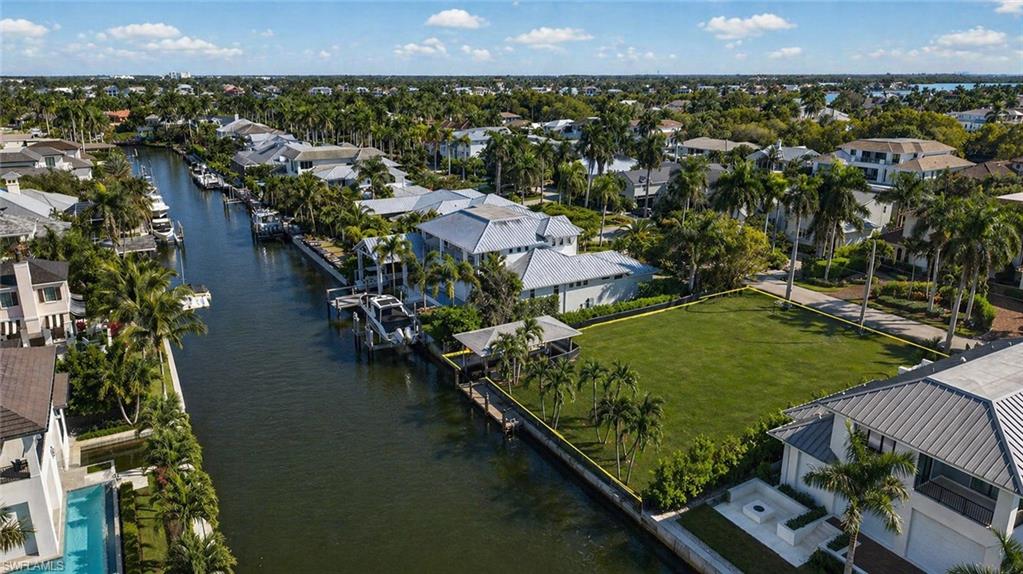 An exceptional opportunity awaits in the prestigious waterfront community of Aqualane Shores. This rare .30-acre cleared homesite sits directly on a picturesque canal offering direct Gulf access with no bridges—a true boater’s paradise in one of Naples’ most sought-after luxury neighborhoods.
Design and build your custom estate on this prime waterfront setting, where wide canal views, quick open-water access, and a serene coastal atmosphere create the ideal backdrop for the ultimate Naples lifestyle. With generous dimensions and an enviable location including an existing dock and covered boatlift, the property offers limitless possibilities for crafting a world-class residence with dockage, outdoor living spaces, and resort-style amenities. 
Perfectly suited for boating and water-sport enthusiasts, the homesite offers effortless navigation to Naples Bay and the Gulf of Mexico. Aqualane Shores residents enjoy an unparalleled balance of privacy, prestige, and convenience, all within biking distance to the beach and steps from 3rd Street South’s famed dining, boutiques, and cafés. The energy of 5th Avenue South—with its world-class shopping, galleries, and entertainment—is just moments away.
Opportunities of this caliber are increasingly rare. Secure your piece of Naples waterfront paradise and create the custom home you’ve always envisioned in one of the city’s most coveted coastal communities.