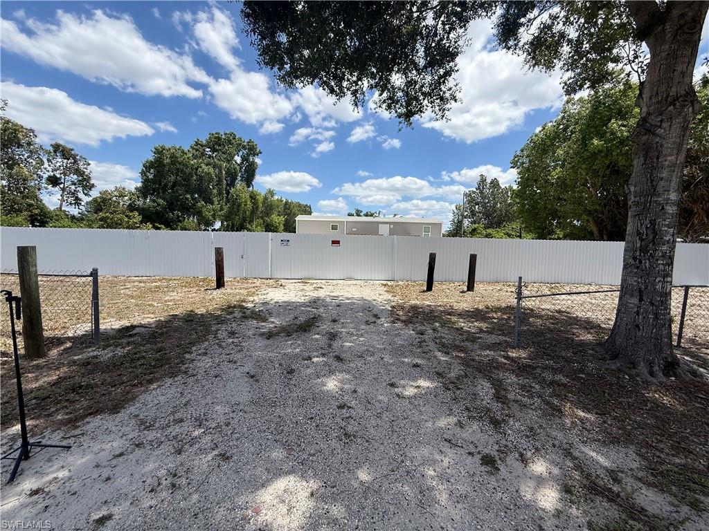 Welcome to this beautiful 2025 manufactured home in North Fort Myers! This furnished 2-bedroom, 1.5-bath home features a fully enclosed porch with a mini-split A/C and a built-in kitchen located in the porch, creating the perfect space for entertaining and year-round enjoyment. The fenced-in property offers privacy and a fully concreted yard for easy maintenance. Move-in ready and conveniently located near shopping, dining, and local attractions.