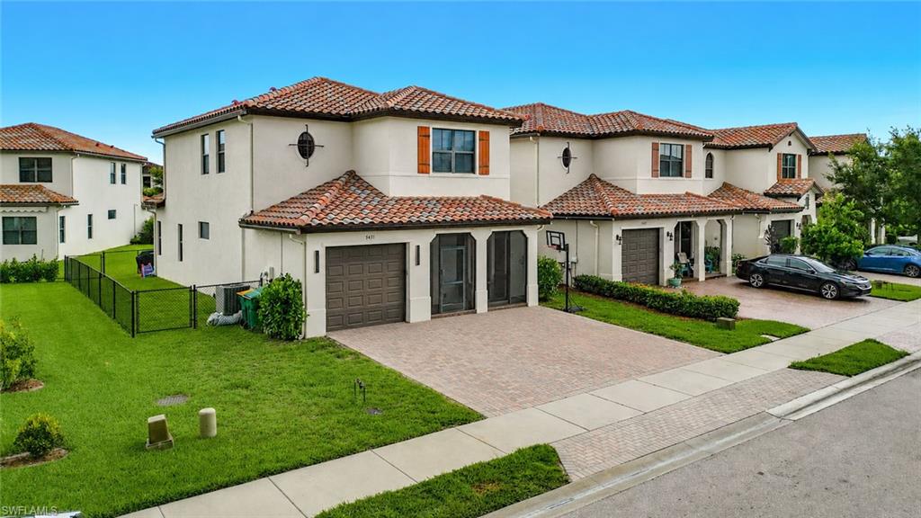Spacious two-story single-family home featuring 4 bedrooms, 3.5 bathrooms, a loft, and a 1-car garage. Located in the Coquina community of Ave Maria, this Encinitas model stands out with additional space on both sides of the home and a vacant back lot. Ideal for outdoor living, play, or entertaining. The interior features luxury vinyl flooring throughout, providing a clean and low-maintenance living environment. The layout offers functional living space with an open main area, a first-floor primary bedroom for added convenience, and a loft upstairs for additional flexibility. The outdoor space is a key highlight, featuring an extended lanai with a durable aluminum roof and full screen enclosure, creating a comfortable setting for year-round enjoyment. With its unique lot positioning and added outdoor space, this home offers a rare opportunity within the community. Residents enjoy access to Maple Ridge amenities, including a resort-style clubhouse, pool, fitness center, parks, and community spaces, all conveniently located near Ave Maria’s town center, shopping, dining, and schools.