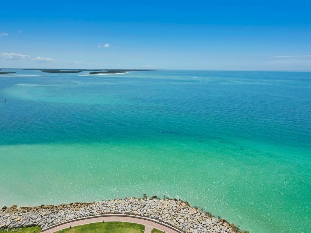 Stunning views of the sparkling blue waters of the Gulf abound from this magnificent 3 bedroom plus den, 3 and a half bath Belize residence located within private, gated Cape Marco.  You will immediately be impressed by the luxurious finishes and details throughout upon entering this gorgeous residence from the private elevator foyer.  The main living space offers beautiful views and elegant wood flooring throughout.  The kitchen is sure to delight any chef with granite counters, center island, and gas cooktop.  The adjacent family room features dramatic windows and custom built-in with shelving and storage.  The stately den offers additional space for guests or a dedicated office.  The master suite is a private retreat complete with access to the front terrace, walk-in closets, and ensuite bath with walk-in shower, dual vanities, and jetted tub.  The two additional guest bedrooms, each with ensuite bath and access to the rear terrace, offer guests much privacy.  The spacious front terrace is the perfect place to unwind and relax while enjoying the island breeze and watching dolphins frolic in the Gulf waters.  Enjoy all of the upscale amenities available at prestigious Cape Marco including 6 HarTru tennis courts and private beach access in addition to the many fine amenities Belize offers - fitness center, theater, guest suites, Gulf-side pool, and more. Live the Cape Marco lifestyle, where luxury is a standard.