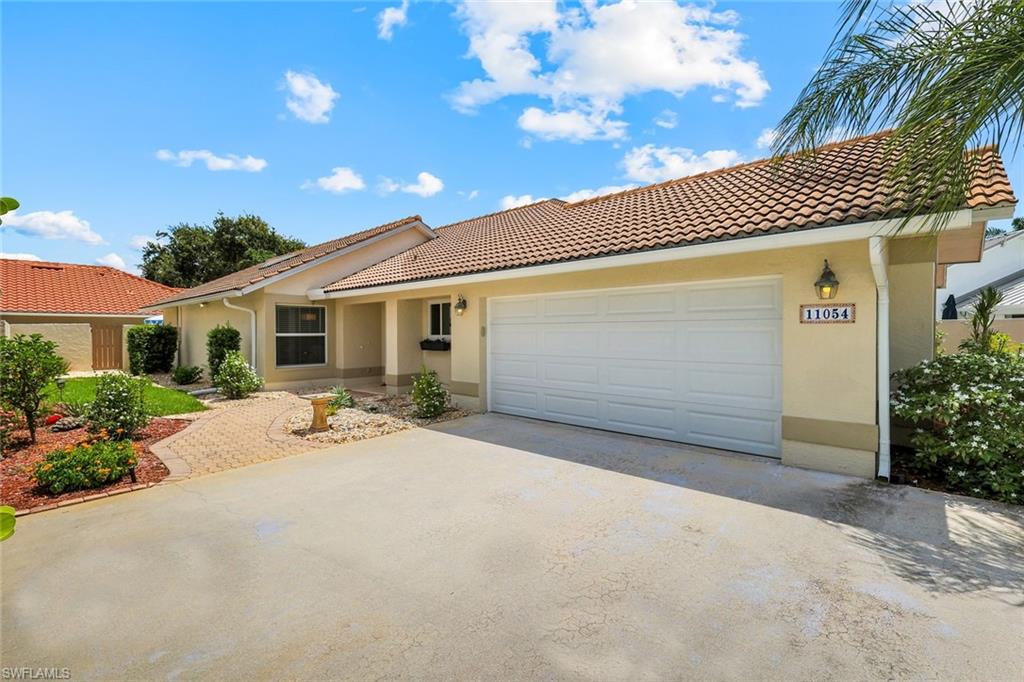 Amazing value for this 3 bedroom, 2 bathroom property in the private and secluded gated community of Longshore Lake. All big-ticket renovations have been thoughtfully completed, 2024 RHEEM AC and NEW DUCT WORK Installed throughout, 2022 New Pool Pump, Halo Reverse Osmosis, IMPACT WINDOWS & DOORS, 2025 COPLAY NEW GARAGE DOOR ensuring both style and security. The home boasts a freshly painted interior and exterior, with an UPDATED KITCHEN & BATHROOMS featuring stainless steel appliances. Step outside to find a spacious lanai with a pool and spa with travertine decking, complemented by an additional water feature, perfect for relaxation or entertaining guests. Low-maintenance landscaping and a multi-zone irrigation system make it easy to enjoy the lush surroundings and create your own tropical oasis. Additional side yard is right outside your front door and is great for kids & pets. Residents will appreciate access to community amenities such as a clubhouse with dining, a resort-style pool, a fitness room, and tennis courts, with pickleball courts coming soon. Ideally positioned, this home is just minutes from shopping, golf courses, dining, grocery stores, and a short drive to the renowned white sand beaches of Naples, offering the perfect balance of tranquility and convenience.