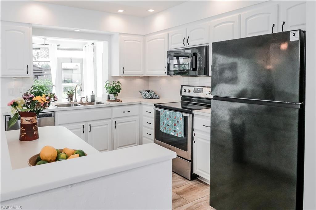 MOVE In Ready! FURNISHED 2+Den/1 & 1/2 Bath, 1 car Garage Cream Puff well-kept Attached Villa! Low Fees $191 A month. Immaculate and clean villa - owner pride shows! Updated AC, Roof 2018, Villa new Re-Pipe 2020 and nice updates to the bathrooms and floors in 2021. New tar roof over garage 2023 permits applied and in process of closing with county. Just a block from 18 hole public Golf Course (optional to join) along with lakewood Pool (Optional Membership to the golf or Recreational options of Lakewood is available separately if desired). Pets allowed. Easy to rent for seasonal income. Close US41 with Sugden Regional Park, New Town Centre Publix next door, Food Truck Park nearby, and 4 Miles to the beach of downtown 5th Ave Naples!