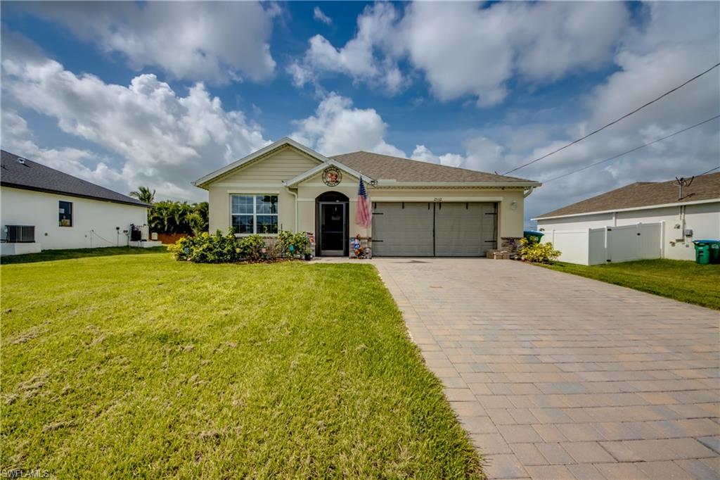 Don't miss this like-new 2024 D.R. Horton Aria model in vibrant Northwest Cape Coral! Offering 1,672 sq. ft. of single-story, open-concept living, this 3-bedroom, 2-bathroom home combines modern style with durable all-concrete block construction. The sleek kitchen features a spacious island, quartz countertops, shaker cabinetry, and stainless steel appliances. The private primary suite is tucked away at the rear with dual vanities and a walk-in closet, while two guest bedrooms sit near the front in a smart split layout. Step out to the covered lanai for relaxing evenings. In pristine condition with highly motivated sellers.
