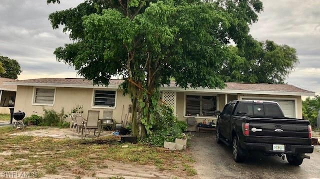 This spacious house has lots of potentials with the newer shingle roof (2016) and 2 ACs (2015), fireplace, remodeled bathroom, and conveniently located near shoppings, restaurants, 41, schools, airports, FGCU and easy access to Cape Coral, Naples. Need some TLC and updates.