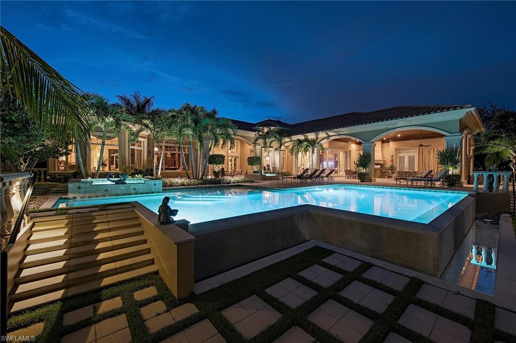Experience paradise in Quail West. This sought-after, single-story located on the private golf course with beautiful lake views and rolling fairways. This magnificent home boasts luxury in every way. Truly a residence for entertaining. Gourmet kitchen which features top of the line appliances with gas stove, butler's pantry and wine room. Two large master suites and panoramic views. Full outdoor living area including fireplace, infinity edge pool, gardens and electric screens to fulfill your quiet nights. A must see!