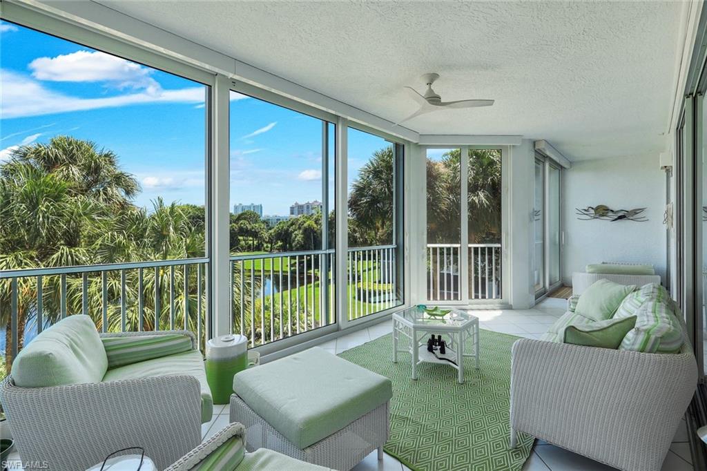 Beautifully updated and impeccably maintained, this elegant residence is located in The Crescent, one of Pelican Bay's most desirable mid-rise communities. Thoughtfully renovated with timeless finishes, this sophisticated condominium offers timeless elegance, exceptional comfort, and effortless living. European white oak flooring flows throughout the foyer, hallway, living and dining areas, and both bedrooms, while custom wall coverings add warmth and refined character. Expansive views of the golf course and sparkling lake create a tranquil backdrop from nearly every room. The chef's kitchen features striking quartz countertops, custom cabinetry, and an inviting breakfast area. Newly installed pocket doors allow the adjoining den to be enclosed, creating a private office or additional sleeping space for guests. Designed for both everyday living and entertaining, the spacious living room includes an adjacent  bar and wine cooler while the owner's suite offers generous closet space with additional custom storage. The updated guest bath and powder room showcase elegant granite countertops and quality finishes. The tiled lanai, complete with impact-resistant sliding glass doors and desirable southwest exposure, provides the perfect setting for relaxing evenings, outdoor dining, and spectacular Naples sunsets. An oversized two-car garage beneath the building offers secure, covered parking and exceptional storage. Ideally located just a short stroll from the Pelican Bay Community Center, residents enjoy convenient access to a state-of-the-art fitness center, personal training, Pilates and yoga classes, eight Har-Tru tennis courts, and Pelican Bay's spectacular 20-court pickleball complex. The Crescent is also within easy walking distance of Publix, Ace Hardware, The UPS Store, charming cafés, and neighborhood dining, making everyday living as convenient as it is luxurious. Pelican Bay's exceptional lifestyle also includes nearly three miles of private sugar-sand beaches with tram service, two private beachfront restaurants, 10 additional Har-Tru tennis courts at The Commons, scenic walking and biking paths, and kayaking and paddleboarding. Just minutes from Waterside Shops, Artis—Naples, and world-class dining and entertainment, this exceptional residence offers the very best of Naples luxury living. This pet-friendly community allows two dogs (subject to weight restrictions). Offering timeless design, an exceptional location, and the unmatched Pelican Bay lifestyle, this is Naples luxury living at its finest. Easy to see at short notice.