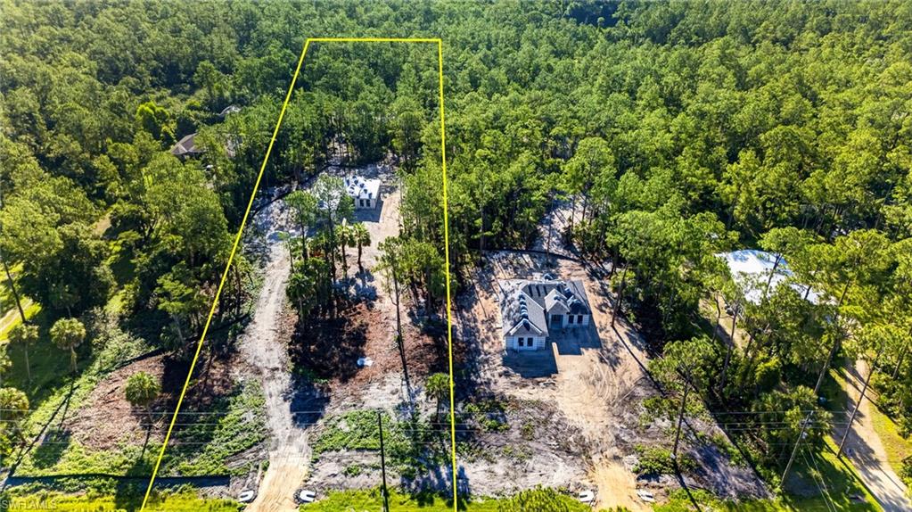 Must See 2.5 Acres property under construction!! This absolutely beautiful house sits about 250' from the road, surrounded by pine trees and simply perfect for anyone looking for space, rural, peaceful living while having access to all the amenities of close proximity to town WITH the benefits of a brand new construction! The  ample floor plan features almost 1700 sq ft of living space; a split floor plan boasting spacious bedrooms and living room; 9'4" high ceilings with 10' tall tray ceilings; tile carried out throughout the house creating a clean, seamless, and spacious look; a fresh modern kitchen with all CUSTOM CABINETS, quartz countertop, a waterfall island; charming electric fireplace feature wall in the living room; crown molding on main living area and master bedroom; 6" baseboards throughout; 8-ft doors; and beautiful, modern bathrooms featuring vessel sinks and custom cabinetry. ALL IMPACT RESISTANT WINDOWS AND DOORS. Automated sprinkler system and asphalted driveway. This 2.58 acre lot allows plenty of space for a pool, a garden, a shop, boats, horses, chickens, you name it! ***MLS pictures are a REPRESENTATION OF A SIMILAR MODEL- ONLY,  actual finishes vary.