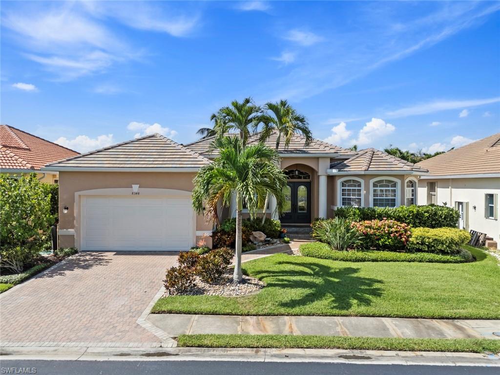 Welcome home to this beautiful 3-bedroom, 2-bath residence, where comfort, style, and the best of Florida living come together. Nestled in a peaceful setting with a lush, tropical backyard, this home features a sparkling pool and spa overlooking a private oasis—perfect for relaxing or entertaining family and friends. Designed to embrace the indoor-outdoor lifestyle, the spacious covered *South Facing* lanai flows seamlessly to the pool, spa, and expansive sun deck, creating the best 4 season retreat. The pool has been thoughtfully upgraded with new solar and electric heating, color-changing LED lighting, and full wireless connectivity, allowing you to control all pool equipment from virtually anywhere. A charming paver walkway with a fountain leads to the elegant glass double-door entry. Inside, you’ll find an open great room floor plan with soaring cathedral ceilings, tile flooring throughout, 8-foot doors, plantation shutters, and pocket sliding glass doors that bring the outdoors in. The bright breakfast nook features a picture window overlooking the tropical landscape, while the well-appointed kitchen offers a large island, premium wood cabinetry with pull-out shelves, granite countertops, and stainless steel appliances. The spacious primary suite is a true retreat with a tray ceiling, crown molding, and a luxurious en-suite bath featuring dual vanities, a soaking tub, and a walk-in shower. Two generously sized guest bedrooms, abundant closet space, and ample storage provide comfort and convenience for family and guests alike. Recent updates include a new tile roof (2023), HVAC system (2021), impact-rated garage door, and a pool enclosure with no-see-um screening, a sprinkler system and beautifully landscaped grounds with mature tropical landscaping, fruit-bearing trees, creating your own private Florida paradise. Ideally located just minutes from Sanibel Island, Fort Myers Beach, Lakes Park, shopping, dining, and more, this exceptional home offers the perfect blend of privacy, quality, and convenience. Come experience the Florida lifestyle you’ve been dreaming of.