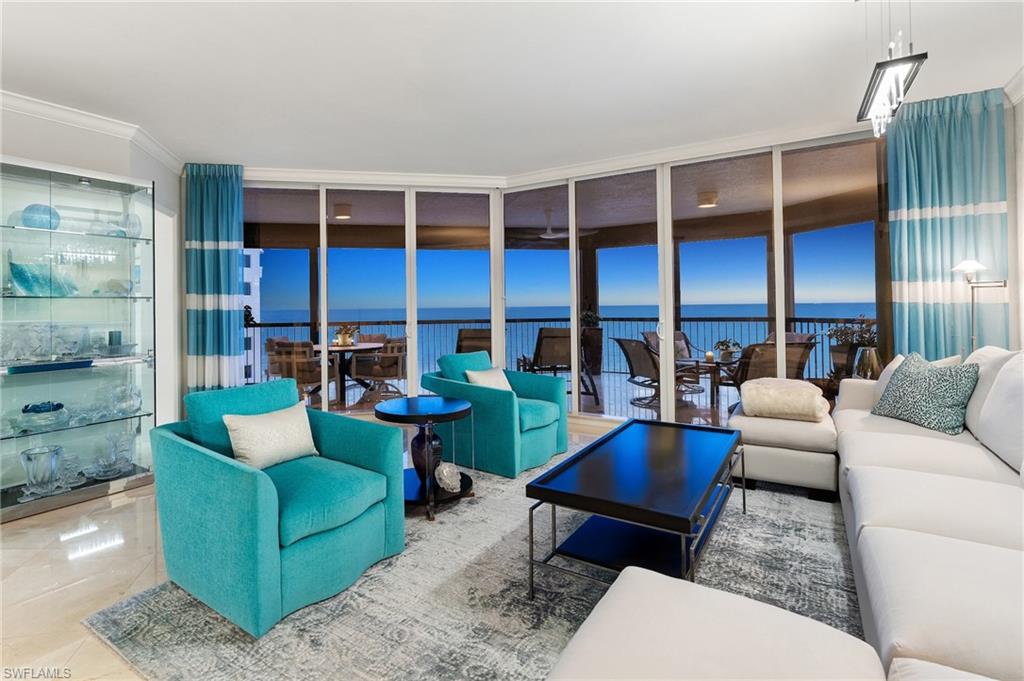Featuring the unique offering of a private cabana, this exceptional three-bedroom plus den residence is perfectly positioned on the coveted southwest corner of the Biltmore at Bay Colony, this exceptional three-bedroom plus den residence in the sky sits directly on the crystalline Gulf coastline, offering breathtaking panoramic views. From the moment you enter, the eye is drawn through the great room to the expansive balcony beyond—an ideal setting for entertaining or simply soaking in the endless sea and sky.  Updated interiors are thoughtfully curated to reflect the serene hues of the Gulf, creating an elegant coastal ambiance complemented by the soothing sounds of the surf. The spacious, light-filled kitchen is a standout, featuring Taj Mahal quartzite countertops, custom modern cabinetry, and gourmet appliances, all surrounded by walls of glass that flood the space with natural light.  Guests will enjoy two generous ensuite bedrooms, each with access to the southeast-facing lanai—perfect for quiet mornings and soft sunrise views. The primary suite is a true retreat, offering direct Gulf views, a beautifully appointed bath, and a perfectly designed walk-in closet.  With neutral finishes throughout, abundant space for family and friends, and an ideal seventh-floor elevation capturing both beach and open Gulf vistas, this residence truly has it all.  Biltmore at Bay Colony offers a resort-style lifestyle with a luxurious pool, state-of-the-art fitness center, and 24-hour security, all within the privacy of the Bay Colony gates. Residents also enjoy exclusive access to the private beach club, tennis facilities, and more—delivering the ultimate Naples coastal living experience
