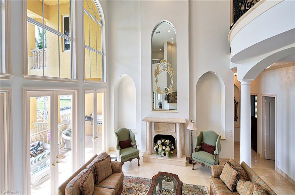 H1245 -Beach & boating! Privately situated custom Gulf access home is 5,178 sq ft. Comprised of 5+bedrooms plus billiard & bonus room off the lagoon style pool. Combines functionality for everyday casual living w/a dose of formality. Upon entering the double solid wood front doors, you are greeted w/floor to ceiling glass. The beautiful foyer opens up to a gorgeous staircase w/full slab marble stairs & a living area w/dramatic volume ceilings, fireplace and elevator. The gourmet kitchen opens to family room w/stunning mitered windows on all 3 floors. Custom millwork and solid doors throughout. Oversized luxurious master suite and bath has a make up area, jacuzzi tub & large shower. Three levels to enjoy the preferred southern exposure which affords sunny views from the open terraces and all living areas. Expansive 50’ Dock/Lift capacity is 13,000 lbs. Home has a 3+ car garage and is complemented by a circular paver driveway and mature lush landscaping. Conveniently located close to a plethora of fine dining and shopping, La Playa private club and the Ritz. Just a few minutes out to the Gulf, the ultimate in boating from your backyard! Only a 2 minute walk to deeded beach access!