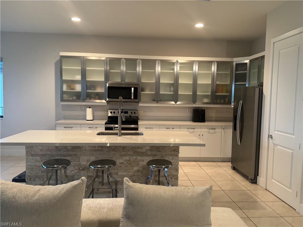 Beautiful single-family home built in 2022 in the desirable Ave Maria community. This well-maintained property features spacious living areas, modern finishes, an open-concept kitchen, and abundant natural light throughout. The home includes a private mother-in-law suite with its own living space, offering flexibility for guests, multigenerational living, or additional privacy. Enjoy a large backyard, ample parking, and convenient access to shopping, dining, parks, schools, and community amenities. Move-in ready and designed for comfortable Florida living.