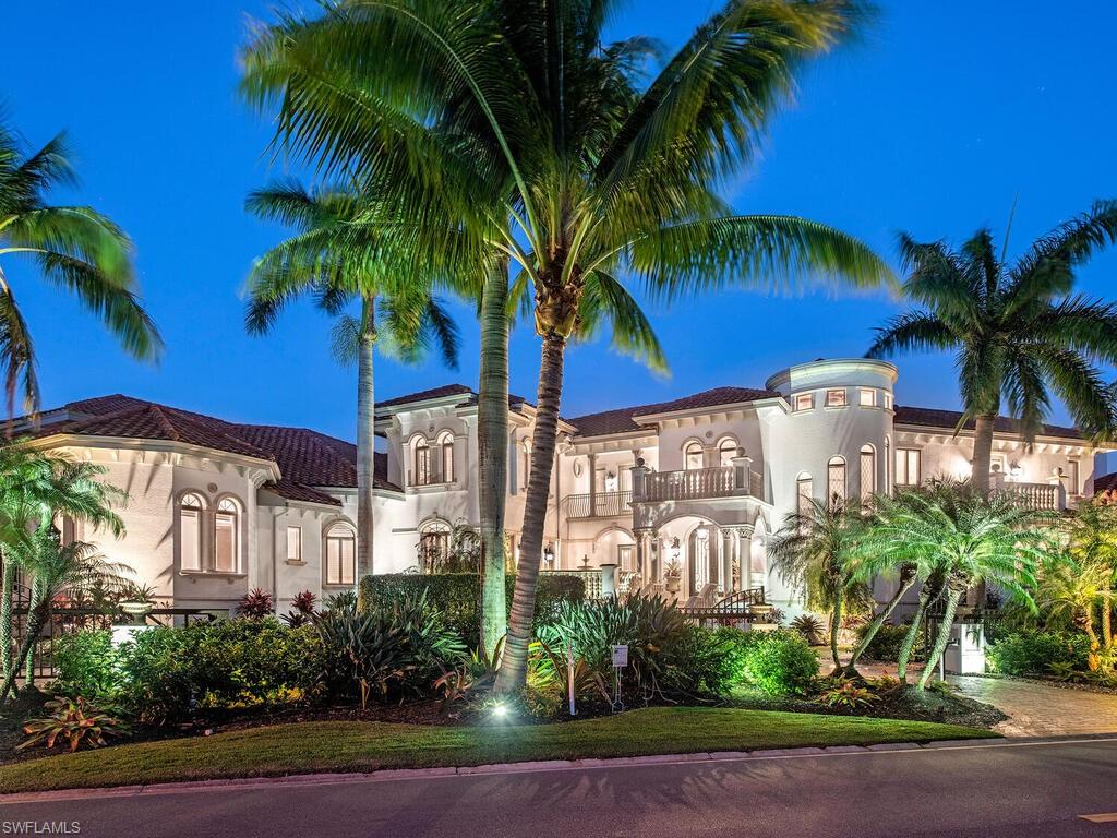 WELCOME TO NAPLES PERFECT!  This custom built, meticulously maintained estate extends a city block from 16th Avenue S to 17th Avenue S facing Gulf Shore Blvd, and only steps to the beach.  Situated on Lake 25 with .74 acre it offers the right balance of privacy yet inviting spaces to entertain friends and family.  Prefer quiet time with the family?  It has a magnificent soundproof theater room that comfortably seats 6.  The home has 8 bedrooms, a guest house with private driveway, 9 full bathrooms and 2 half baths, 4 sets of washers and dryers, a spa, a 50 ft lap pool, and a main pool with fountain.  A sophisticated HVAC system manages 7 newer high efficiency A/C units and 3 dehumidifiers with a backup natural gas generator ensuring that no matter the weather, the home is protected and dry.  The tile roof has 15 years remaining on its fully transferable, non-depreciable warranty, guaranteed by the roofing company.  For the car enthusiast, the climate controlled 4 car garage has 2 additional lifts that can easily store 4 cars, plus the daily driver and still room for bikes and paddle boards and all your beach gear.