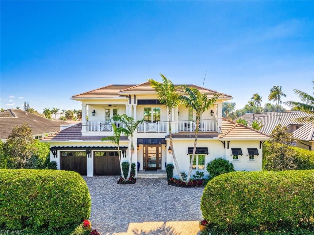 Exquisite four-bedroom plus den home located in desirable Oyster Bay on Jewelbox Ave. One of the only streets offering water on both sides of the street.  Upon entering this open floor plan, you'll be greeted by soaring ceilings, and an abundance of windows offering natural light. The second floor features multiple balconies with beautiful water views. This property has undergone a complete transformation, featuring new floors, baseboards, drywall, and a new resort-style pool/spa with new pebble-tech and tile, top-of-the-line equipment and heater. The home includes a chef's dream kitchen equipped with a Wolf/Subzero appliance package. The outdoor space boasts multiple entertaining areas, including a newly updated fire pit. Boasting three boat docks, including two boat lifts and a jet ski lift, all with new motors by Garland & Garland, this property is a boater's and fisherman's paradise, complete with a newer seawall.  With direct bridge access to the Gulf of Mexico, this centrally located property is just minutes away from downtown Naples, providing the perfect blend of luxury and convenience.