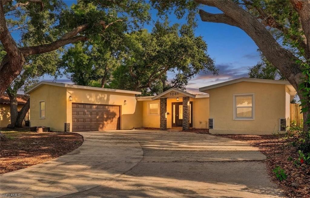 Beautifully situated between three outstanding parks and several schools, you'll find this exceptional home in the Bayou Highlands area of St. Petersburg.  You'll appreciate the personality of the stacked stone pillars and stylish front door with sidelights. Stepping into the home you'll find a bright and welcoming atmosphere.  Enjoy a spacious entry with an ample closet for your guest coats or additional storage.  Head into the heart of the home to find an updated kitchen with warm recessed lighting, stainless appliances, white cabinetry, tasteful tile backsplash and granite counters.  Exceptional cabinet and counter space makes cooking or baking your new favorite pastime.  The breakfast bar with seating keeps your favorite people close while you're prepping for meals or grabbing something quick on the go.  An open floor plan gives you plenty of room to gather or spread out to the formal dining area, living room or lanai space. This home has 2 garage stalls along with 4 spacious bedrooms and 3 updated bathrooms ensuring everyone has a space to call their own.  Welcome Home!