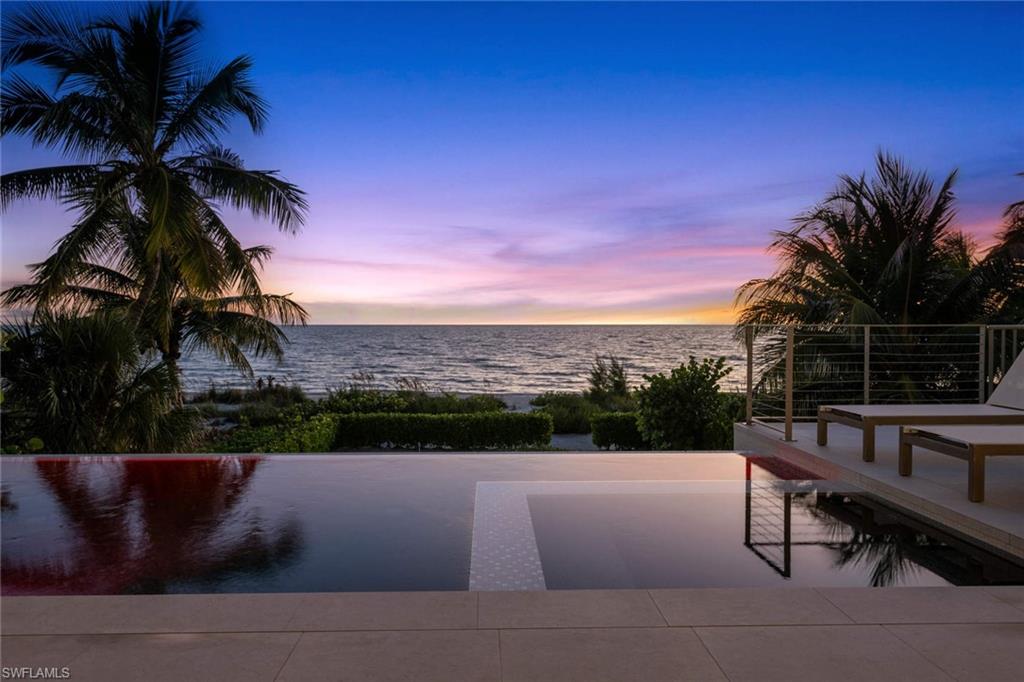 Built in 2020 by award-winning Potter Homes, this magnificent 3-story beachfront home includes 5 bedrooms and den, 8 bathrooms with 5,560-square-feet of living space. There are dual master suites, one upstairs and one downstairs. The home is a coastal contemporary, modern masterpiece with an open floor plan, full of sunshine streaming in from impact-rated doors/windows. Smart-Home technology includes surround sound, full home-automated lighting system, motorized shutters/screens, and private elevator. Fully pocketing sliders lead to the elevated entertainment deck with infinity pool/spa, outdoor summer kitchen and fireplace, all overlooking the Gulf of Mexico. Special touches include tray ceilings, marble baths, wood flooring, ideal for entertaining guests or grandkids. The Chef's kitchen features Thermador appliances, quartz counters, custom wet bar, built-in wine fridge, 4+ car garage, laundry upstairs and downstairs, outdoor shower, metal roof.  Located minutes to Mercato & North Naples amenities, this stately residence is a one-of-a-kind Bonita Beach home.