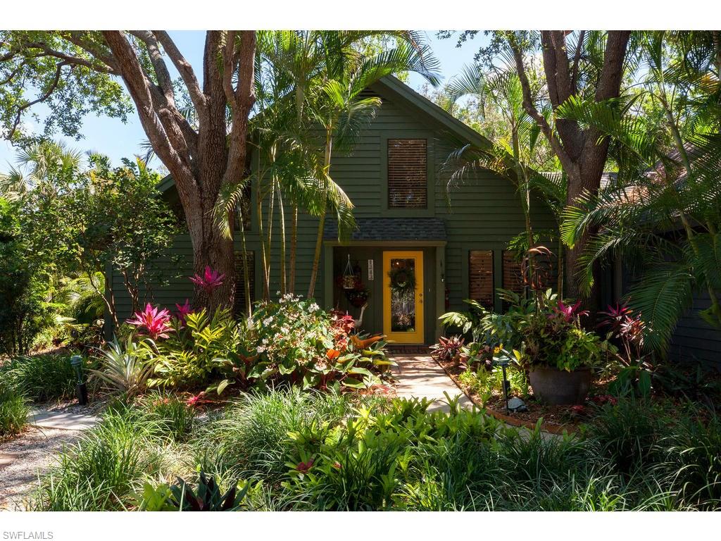 Nestled in the heart of Naples, the quaint enclave of Bent Pines Villas offers residents the feel of single family living with the convenience of condominium ownership....and it's pet friendly!  This beautiful 2 bedroom + den villa boasts one of the best locations in the lushly landscaped community, as a private end unit with dual parking lot access, plus plenty of room for additions. Mexican tile flows throughout and a newly renovated kitchen features stainless appliances, stunning cabinetry, granite countertops and a sunlit breakfast nook. A formal dining area and great room both lead to the charming and secluded outdoor tiled patio.  A built-in wet bar, guest room and den/office complete the first level living, while a large Master Suite with plenty of closet space graces the entire second level. The ultimate in Florida living; residents create their own Naples oasis at Bent Pine Villas with beaches, shopping and dining all nearby!
