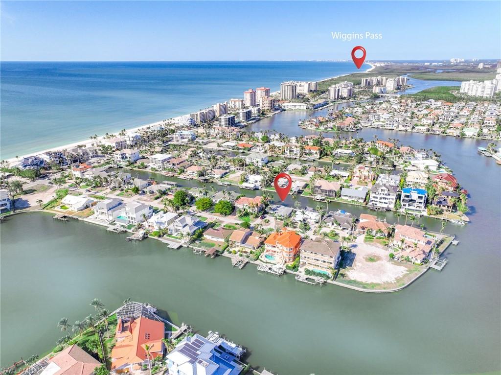 Best value on the beach side! This is the opportunity you have been waiting for. Located on 1 of only 3 coveted finger streets on Vanderbilt Beach. Live the boating and beach lifestyle. Gulf access via Wiggins Pass. Only an 800 foot walk to beach access. This single family home has been mitigated after Hurricane Ian and is ready for renovation or new construction build. 80ft wide lot able the accomodate a spacious new custom home. Just steps to the sand on a quiet stretch of Vanderbilt Beach. Enjoy a short stroll along Gulf Shore Drive to La Playa, Turtle Club, or Delnor-Wiggins beach park. Close to everything. NEW SEAWALL just completed by Orick Marine. Click the virtual tour link to see proximity to beach and Gulf access boating via the Vanderbilt Channel.