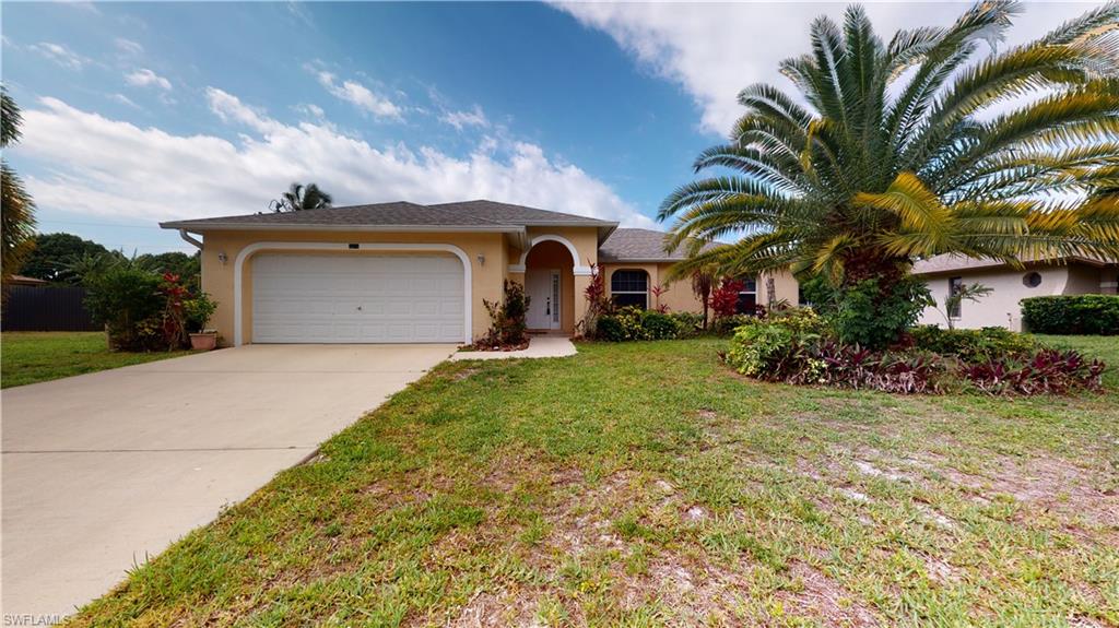 Stop Paying rent and come take a look at this Spacious 3-bedroom 2 bath 2 car garage home with over 1400 sq. ft. of living area with private fenced in backyard and a New Roof. Nestled in prime SE Cape Coral neighborhood just minutes to downtown Fort Myers and extremely close to all the amenities and shopping in Cape Coral or N. Ft. Myers. Located Flood Zone X, with no flood insurance required. This home has an attractive open floor plan with open large living room that flows into the dining space and the eat-in kitchen. All complimented by the split floor plan for the bedrooms. The master suite is a good size with walk-in closet and, has an ensuite with dual sink vanity and walk-in shower. Other features include tile flooring throughout main area, carpet in the bedrooms, Screened lanai under truss, fenced in yard, plenty of room for a pool and southern exposure.